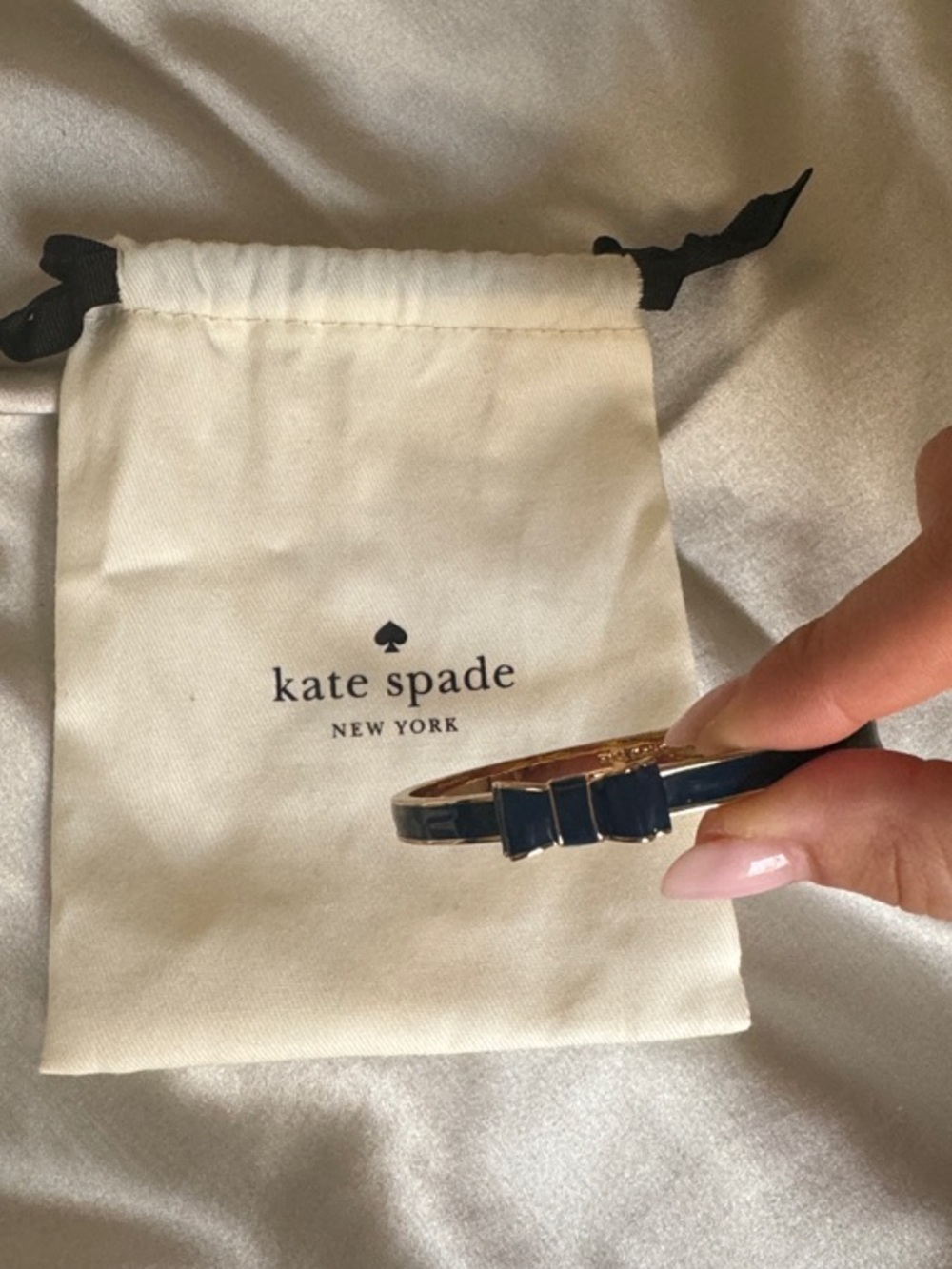 kate spade navy enamel bow bangle with gold-tone trim